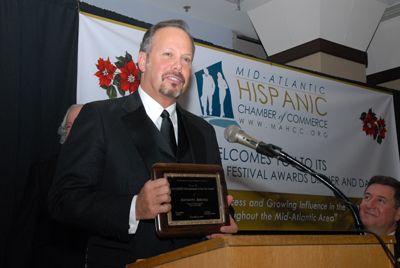 Ex-Virginia Gov. George Allen looks on as MicroTech CEO Tony Jimenez receives Entrepreneur of the Year (photo by E. Becerra)